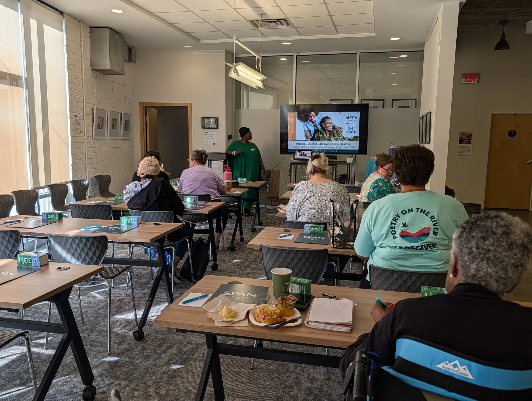 Care partners taking part in an interactive caregiving skills training session